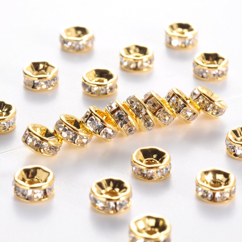 Strassz kerek kövekkel - arany, átlátszó 6x3mm