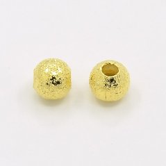 Mosadzná korálka s textúrou - zlatá, 4 mm