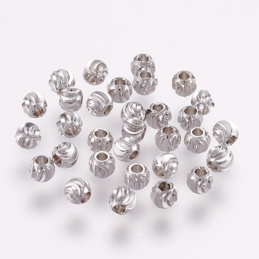 Sárgaréz elválasztó, texturált golyó, 4x3mm