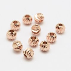 Texturált sárgaréz gyöngy - rózsaszín, 4x3,2 mm