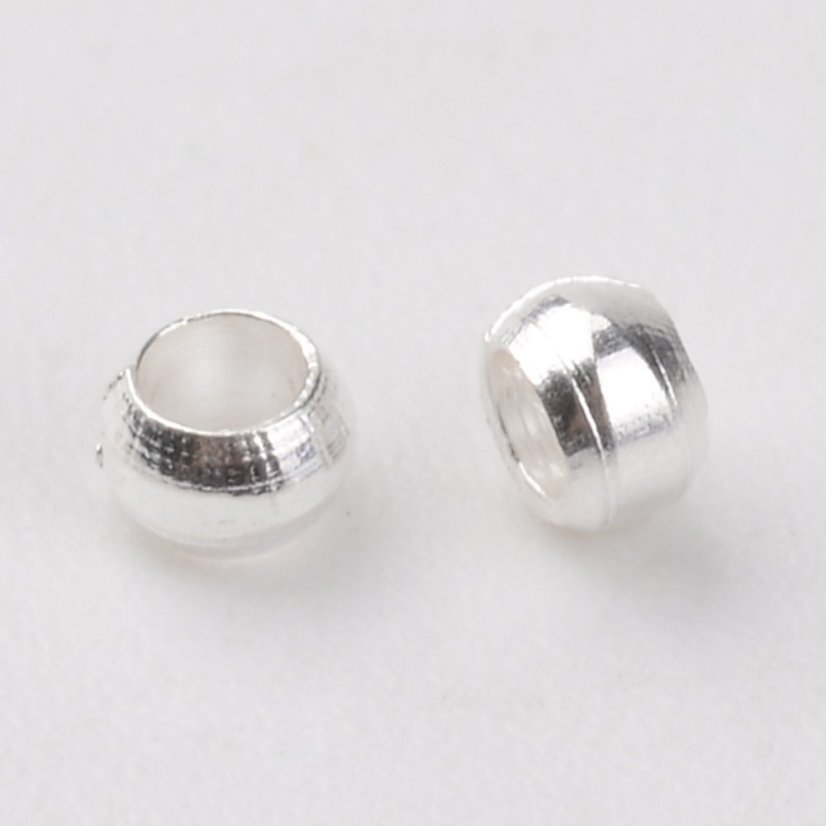 Zamačkávací rokajl z mosazi, kulatý, 2x1,2 mm, stříbrný