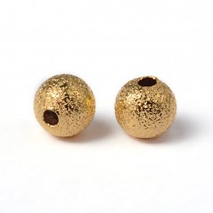 Mosazný korálek s texturou - zlatý, 6 mm