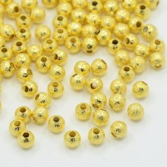Texturált sárgaréz gyöngy - arany, 4 mm